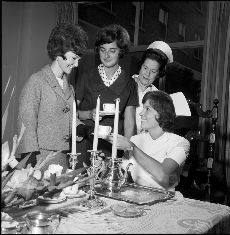 Four nurses at a tea for new students